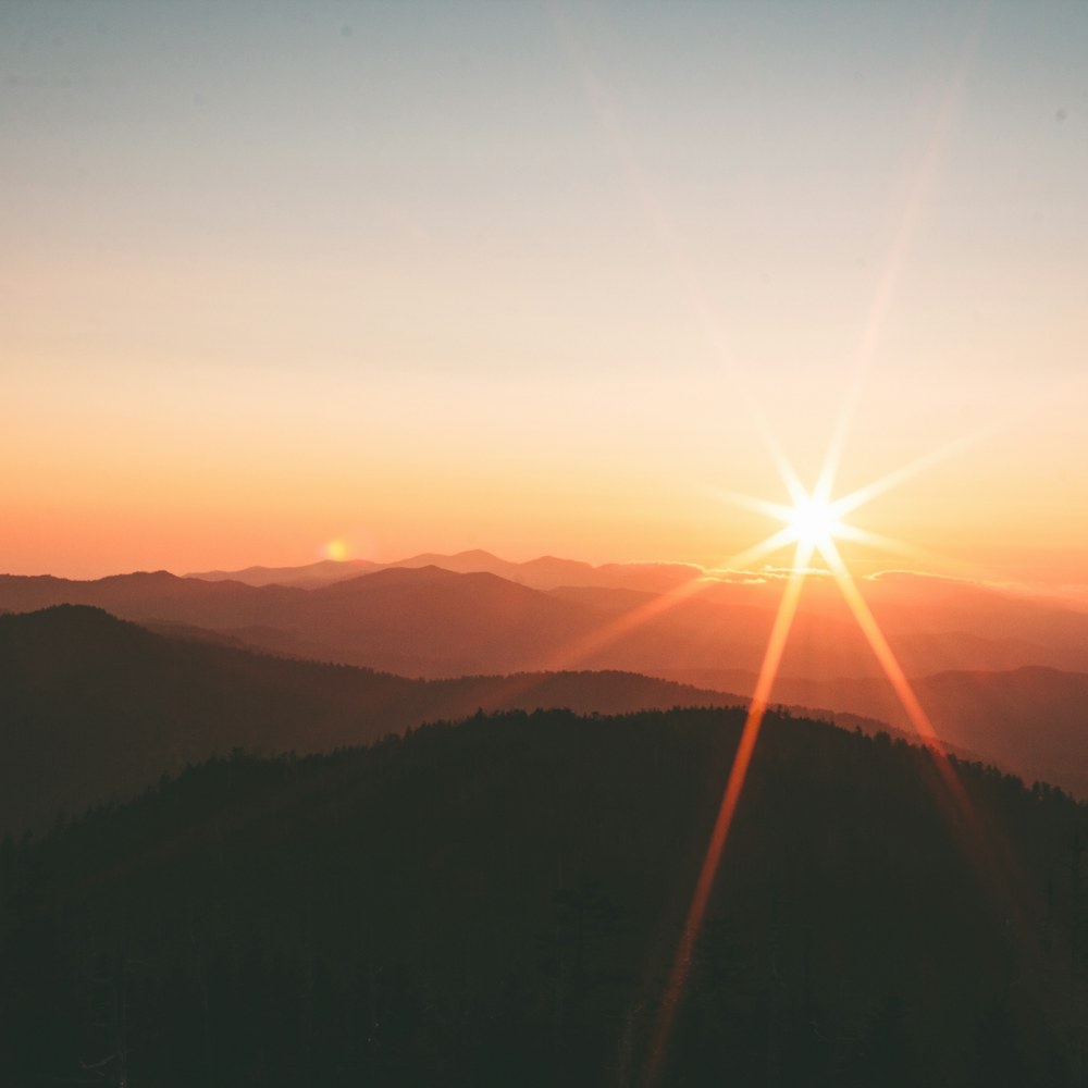 Layered mountains at sunset
